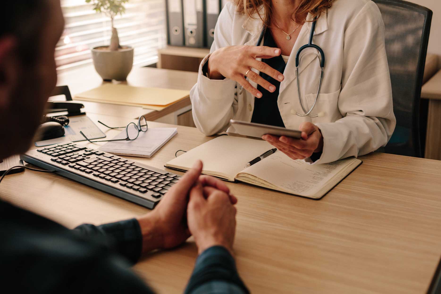 A clinician works with a client at an addiction treatment center.