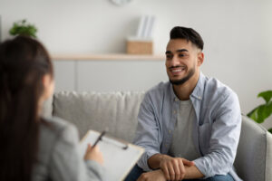 Man talking to a woman about what to discuss in therapy.