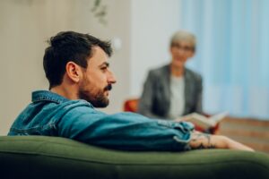 Man talking to his therapist about what is the goal of therapy.