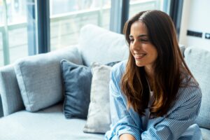 Girl smiling in a session asking about what is inpatient therapy.