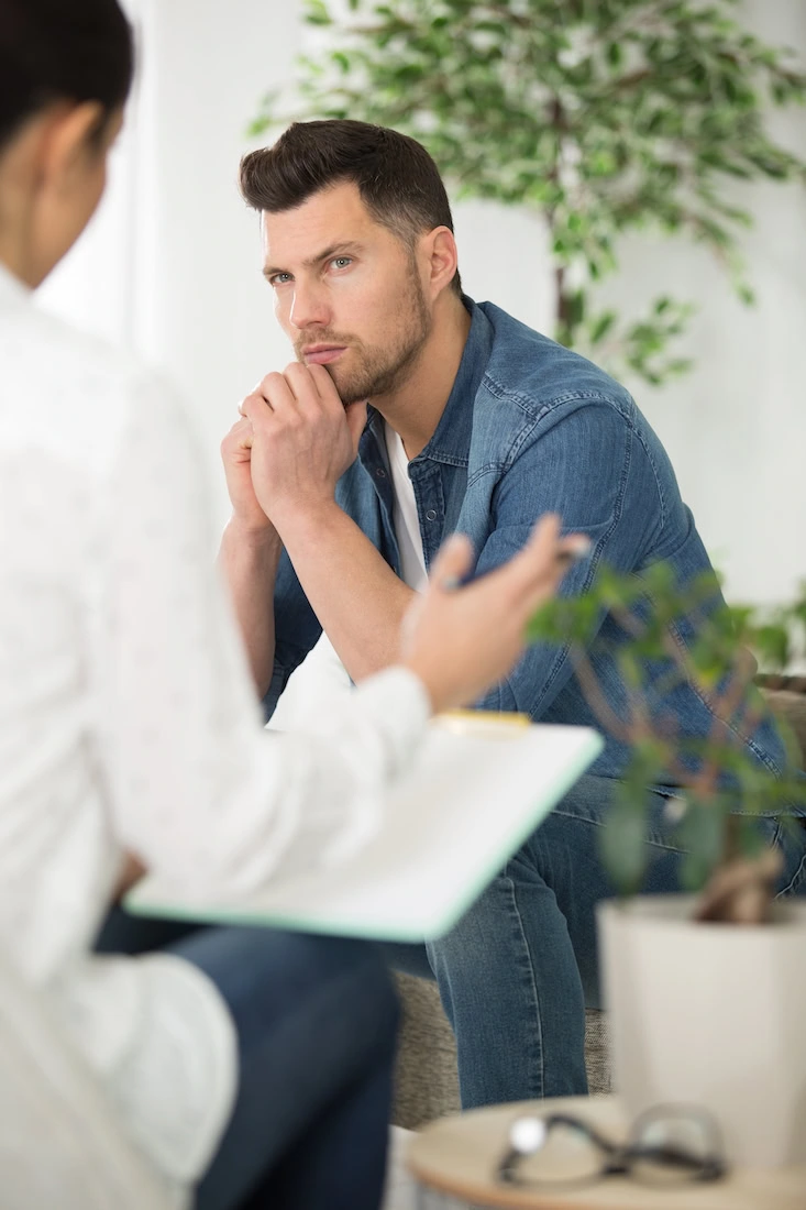 A person participates in therapy at a drug rehab center.
